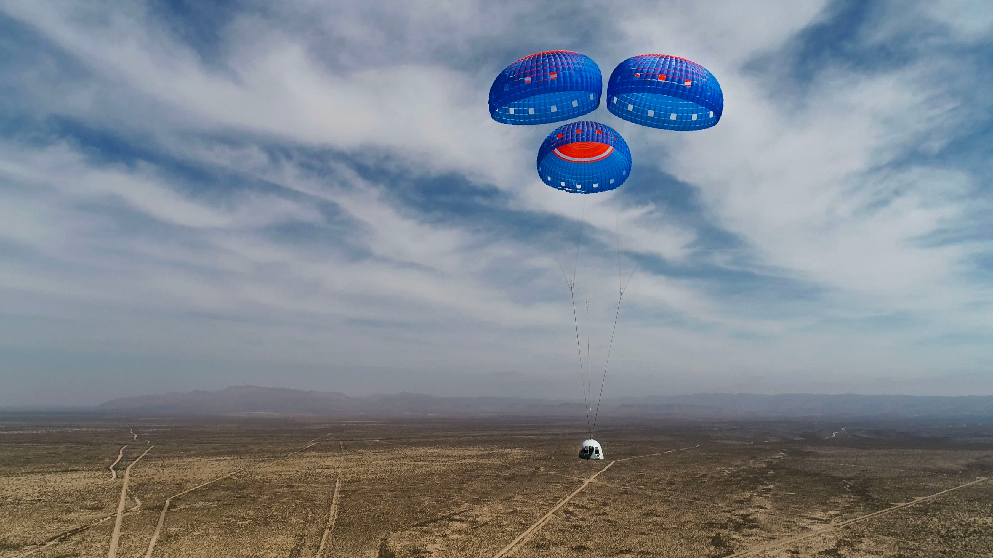 New Shepard's crew capsule descends under parachutes.