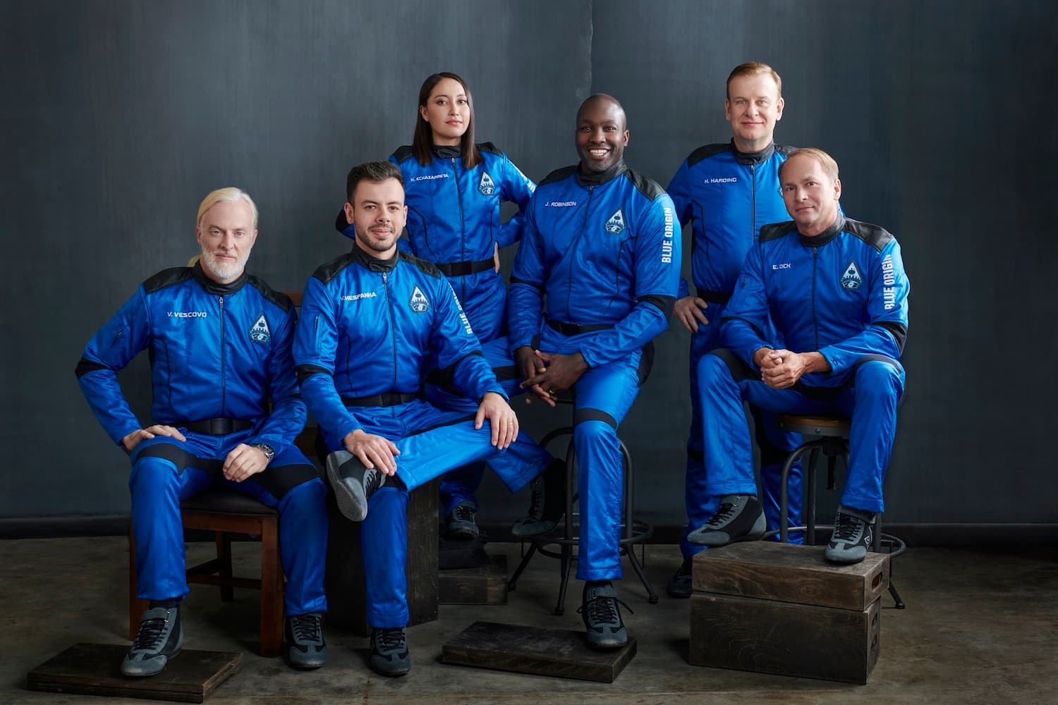 The NS-21 crew poses for their official portrait wearing blue flight suits.