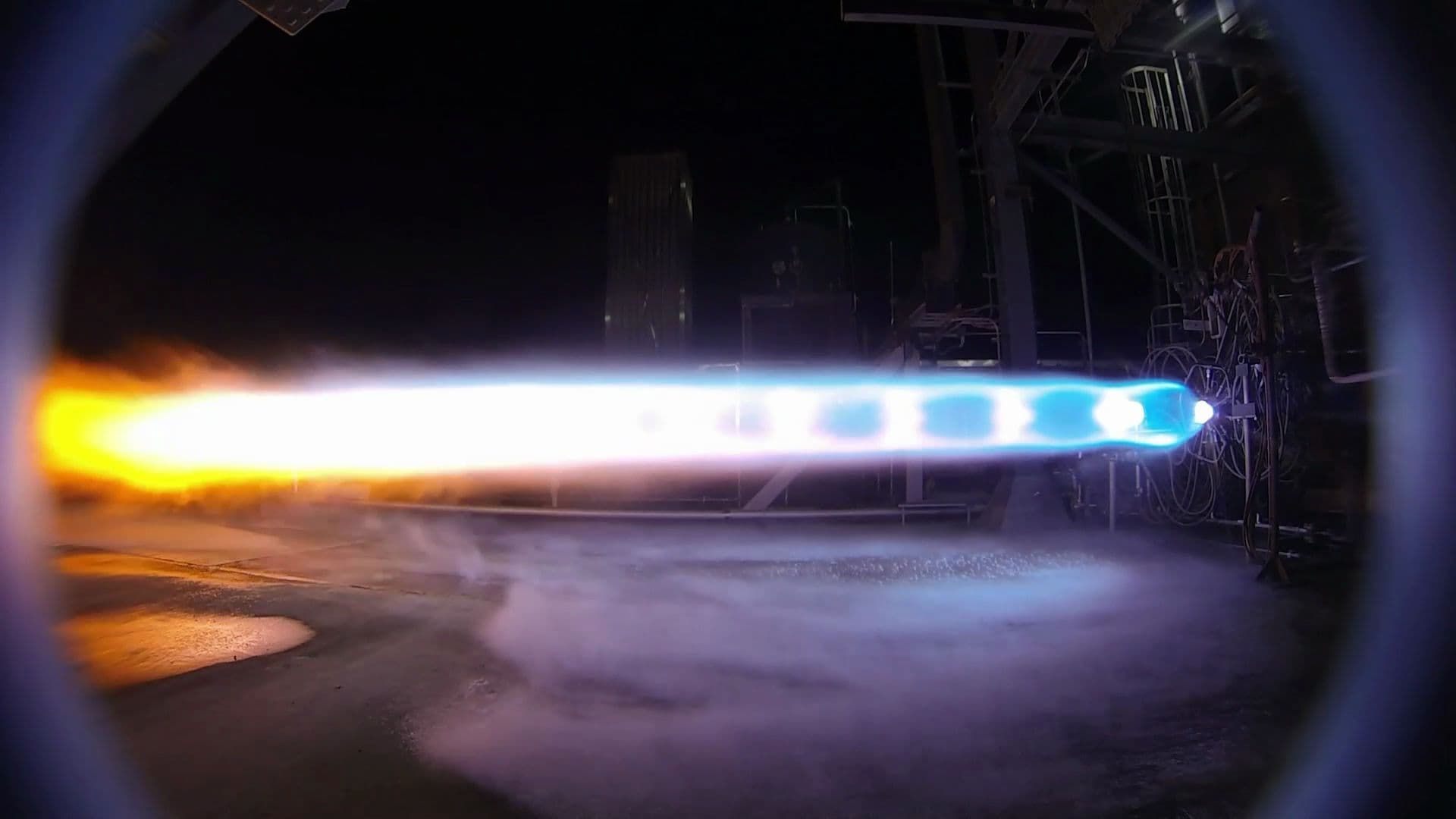 The bright flame from an engine hotfire test.