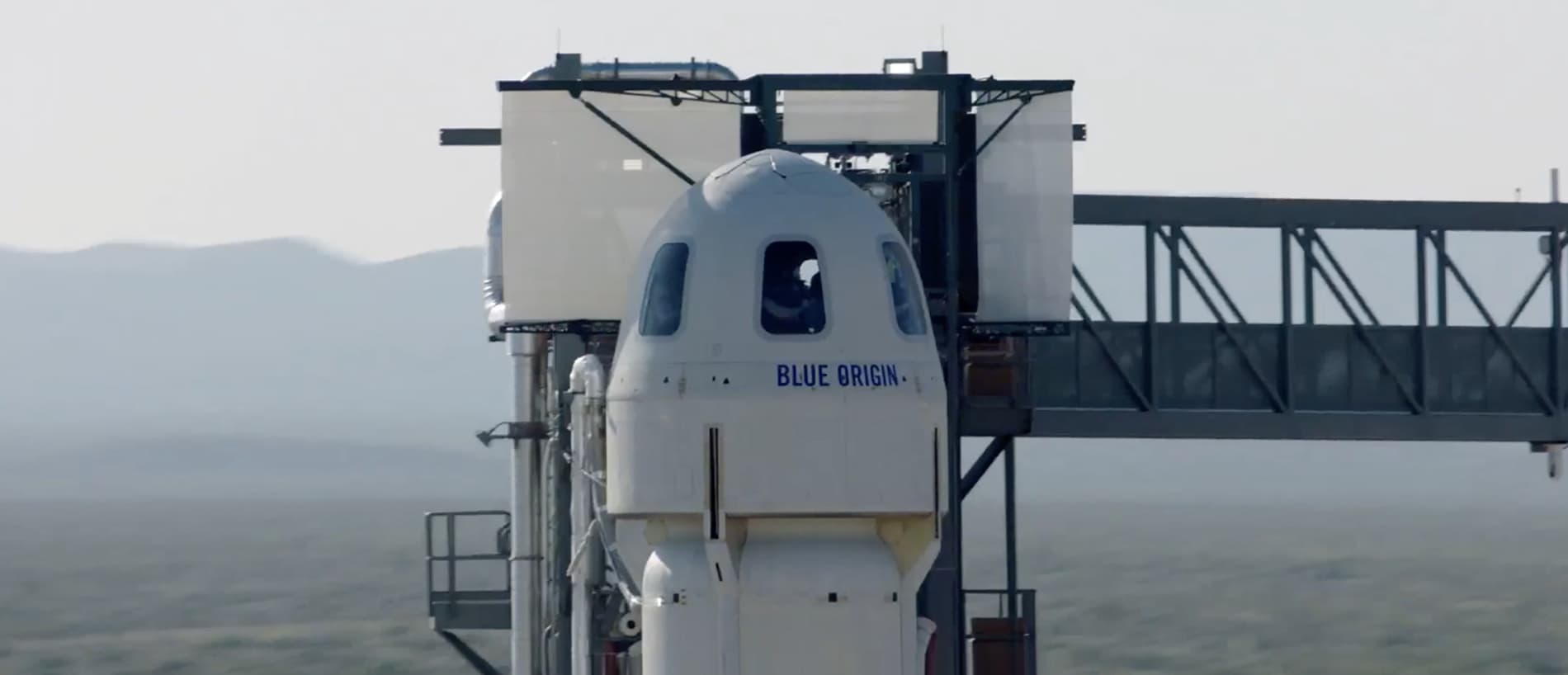 Astronauts in the New Shepard crew capsule on the launch pad prior to lift off.