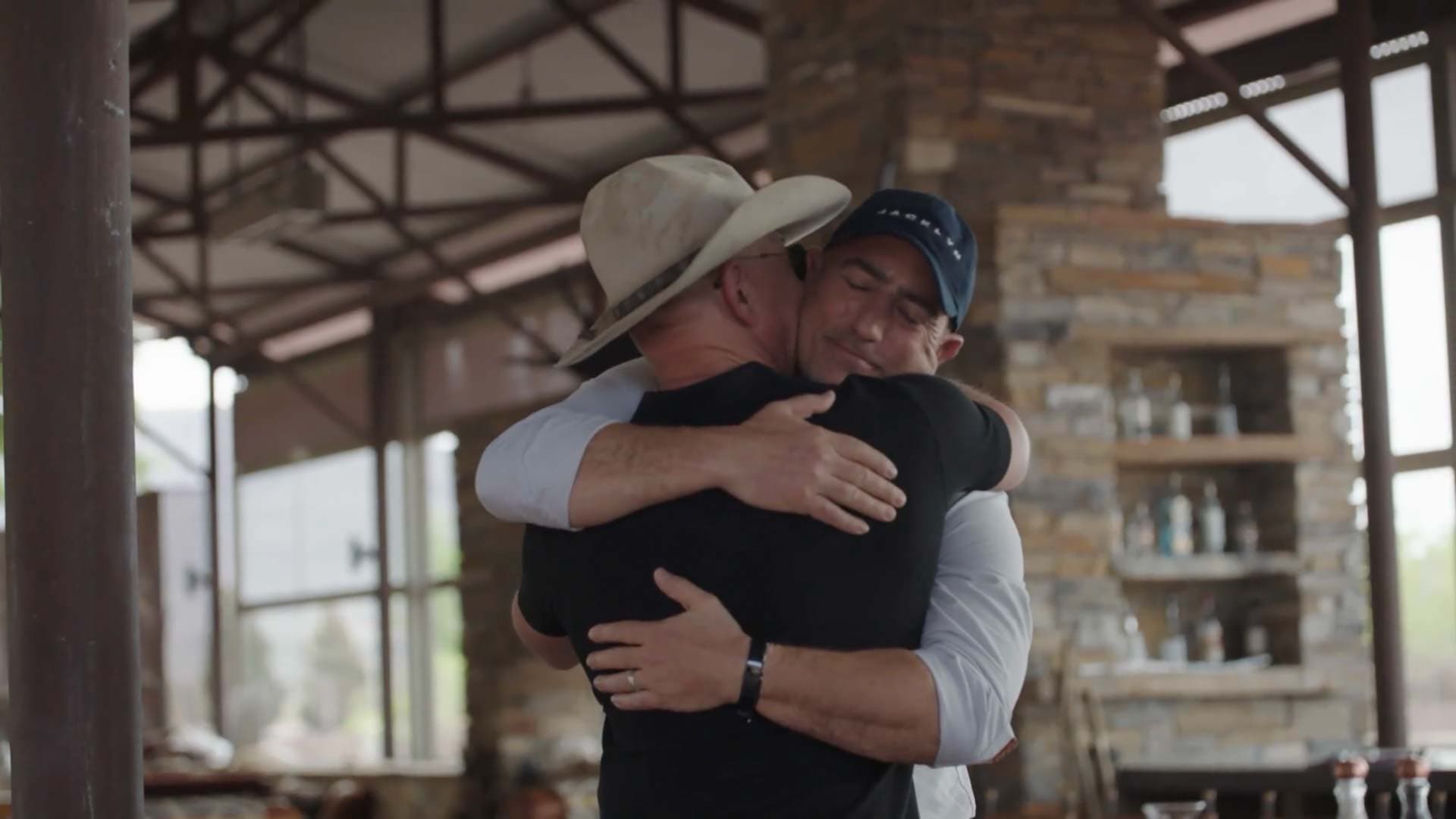 Blue Origin Founder Jeff Bezos hugs his brother, Mark Bezos, after announcing they will fly to space together on New Shepard.