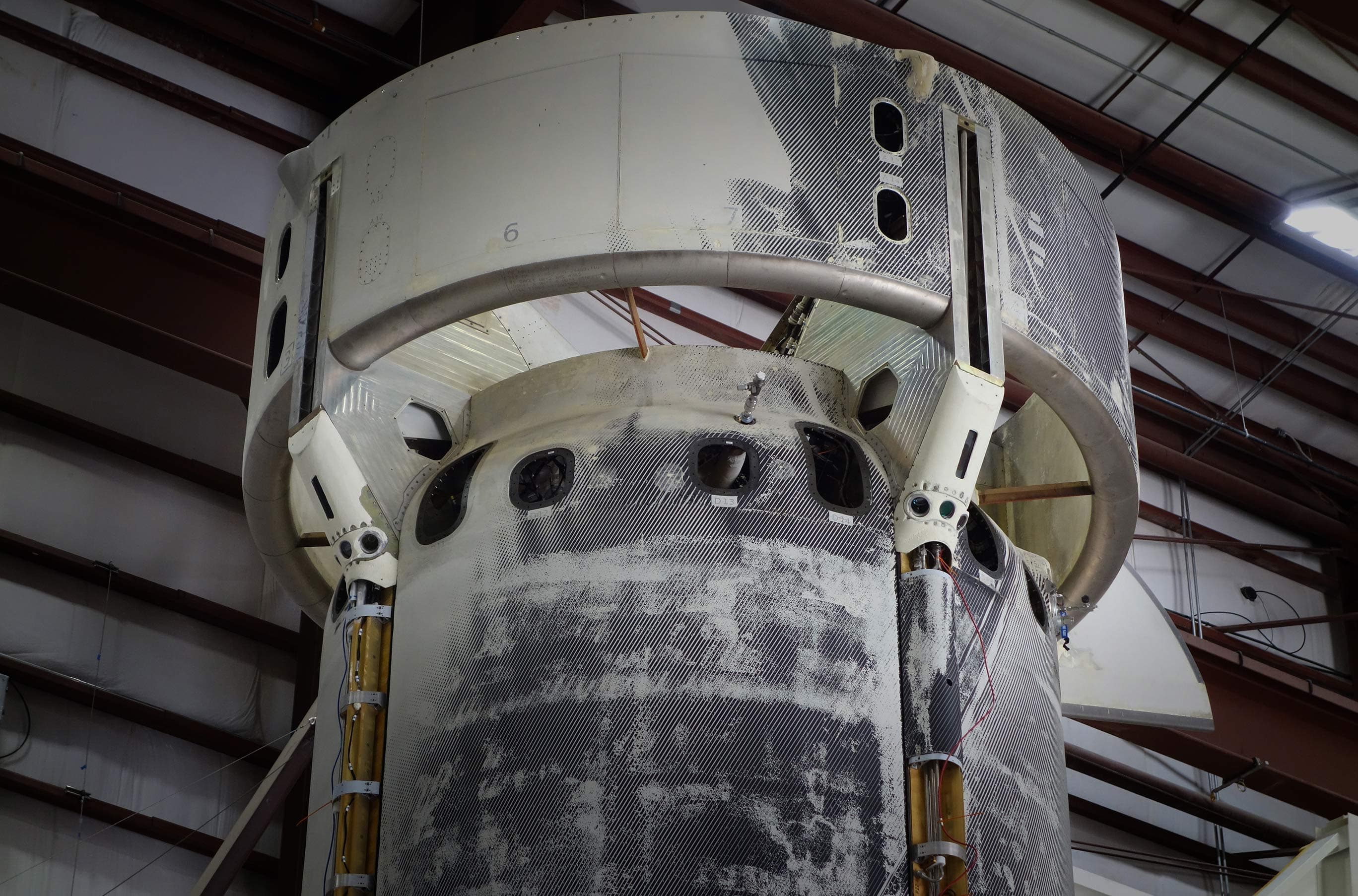 A close-up of the ring and upper portion of the booster where NASA's lunar landing sensor demo is mounted on the exterior.