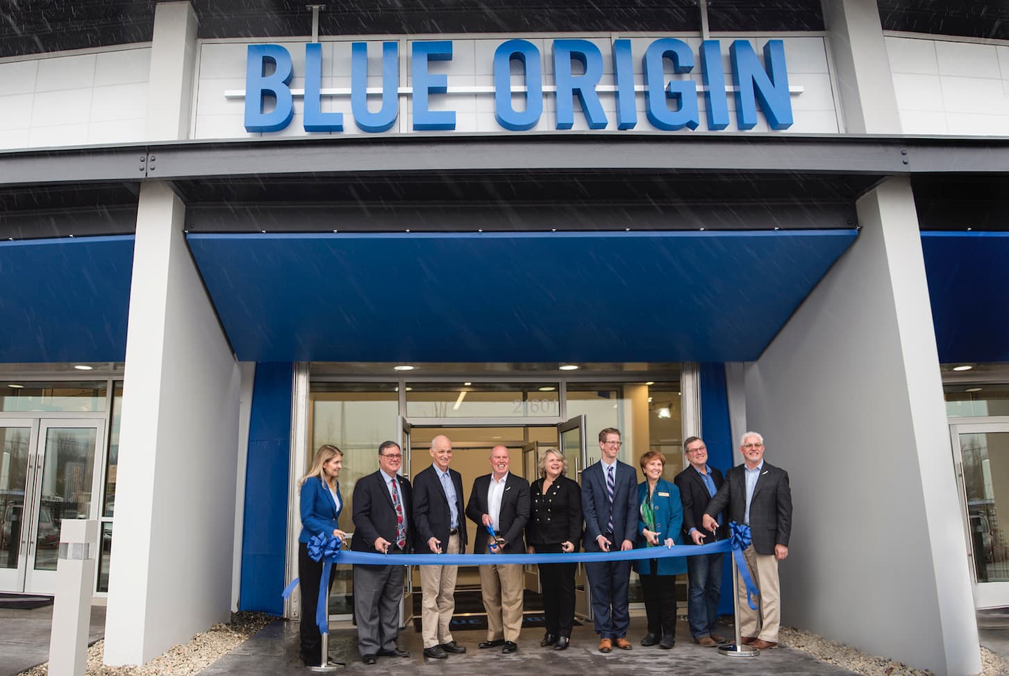 Blue Origin CEO Bob Smith and local leaders pose during a ribbon-cutting ceremony held in front of the new O'Neill Building headquarters in Kent, Washington.