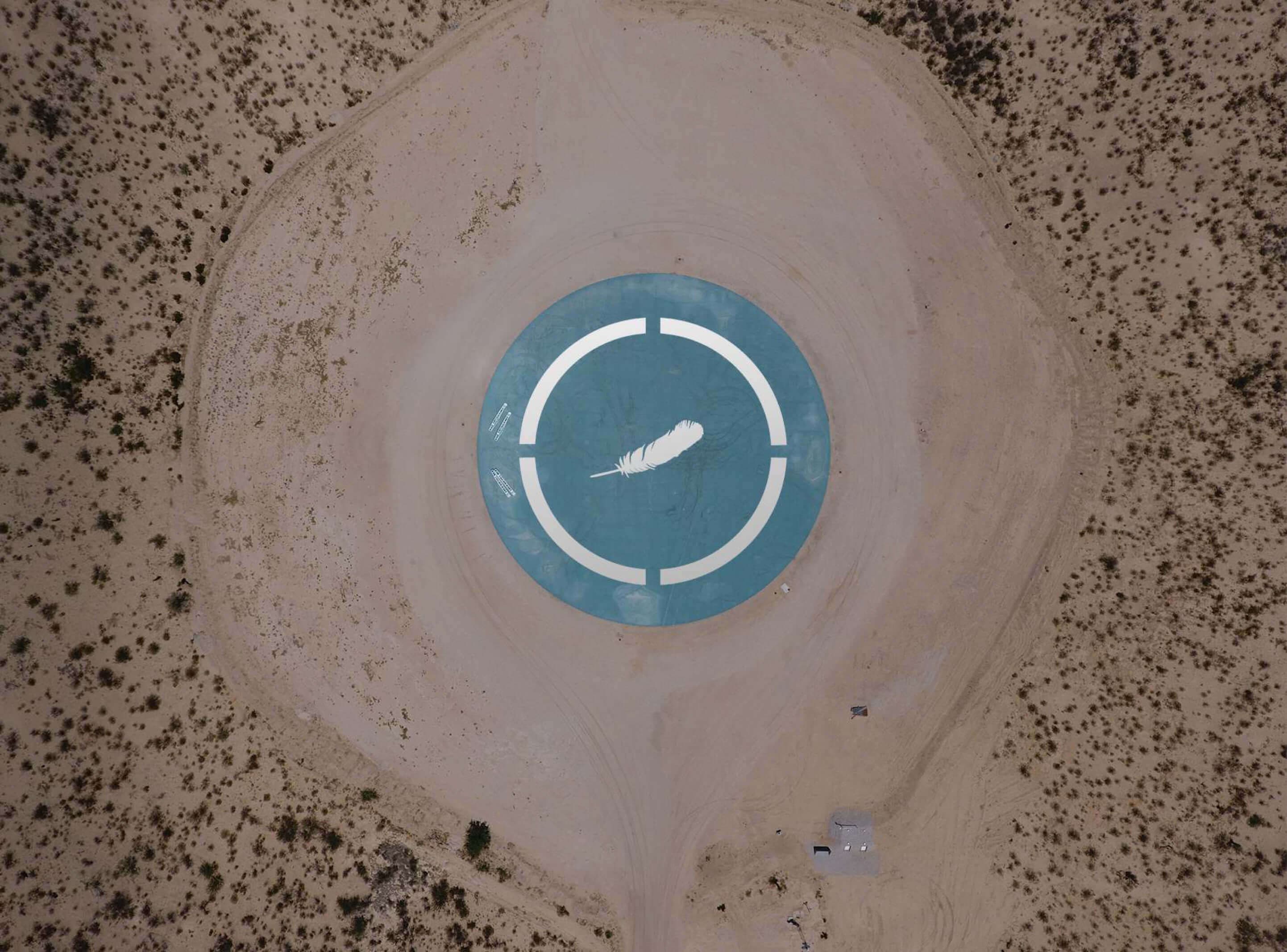 Aerial view of New Shepard's landing pad with feather logo.