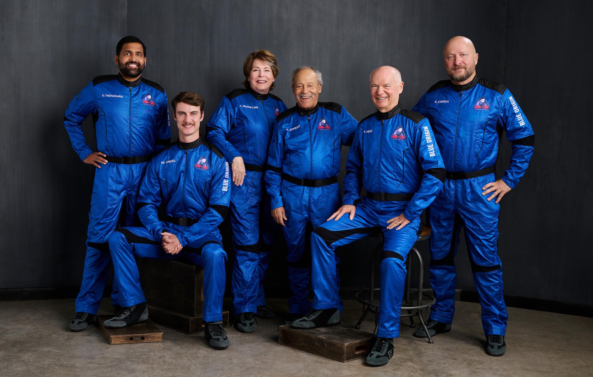 The NS-25 crew poses for their official portrait wearing blue flight suits.